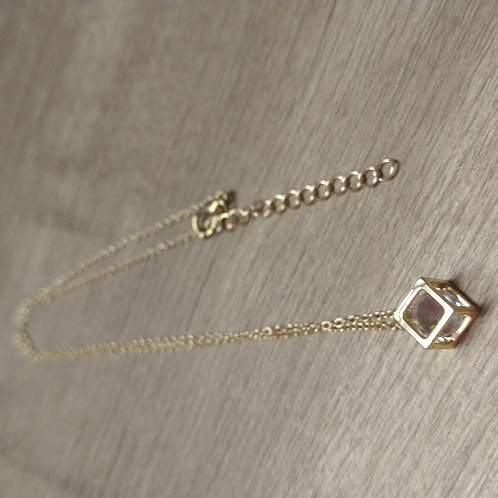White Faux Stone In Gold Box. Faux Stone Moves Around. Goldtone Chain